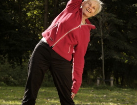 Healthy senior stretching