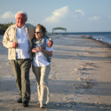 Senior couple walking on beach