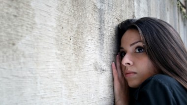 anxious hispanic woman