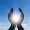 hand cupped to sun