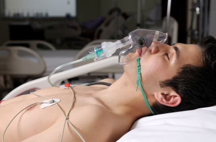 young man w-O2 mask in ICU