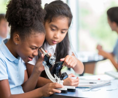 Education of women illustrated by two young girls in science class