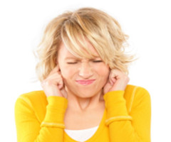 woman plugging her ears with her fingers