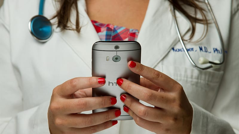Telehealth Nursing Best Practices Woman holding Phone